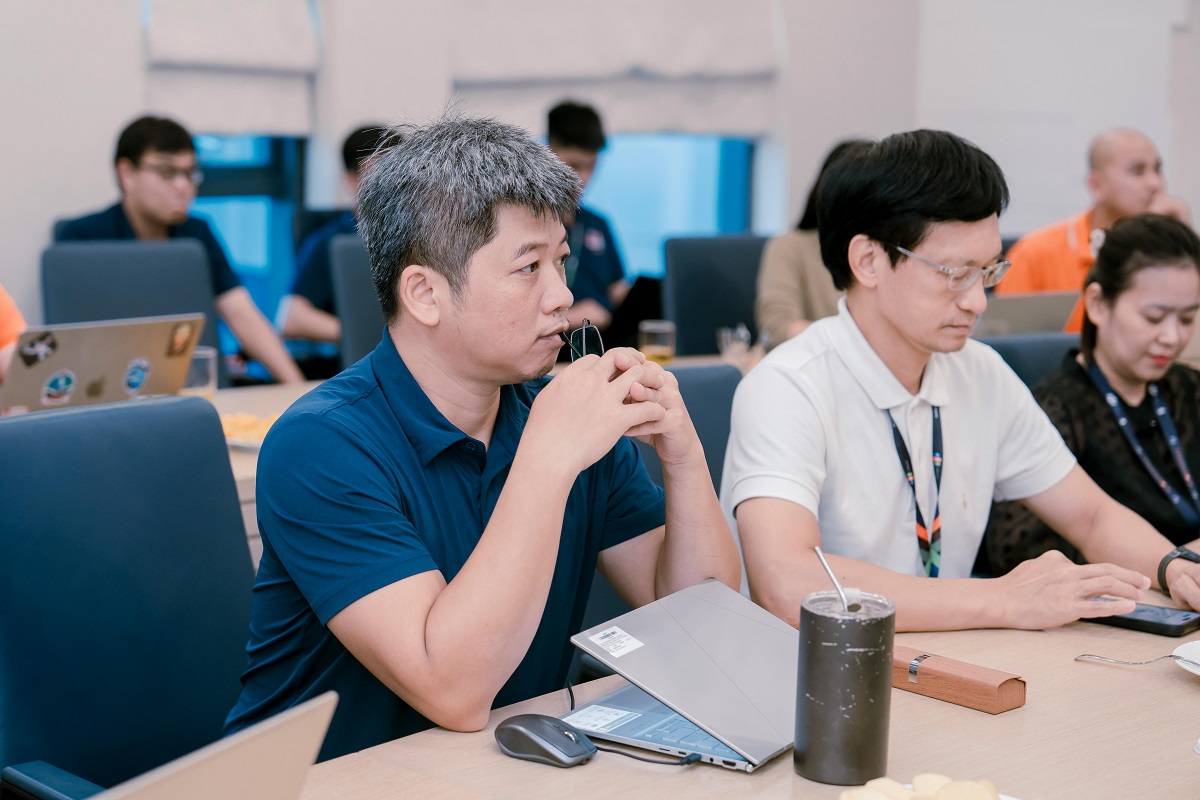 employees using their laptops in a training session